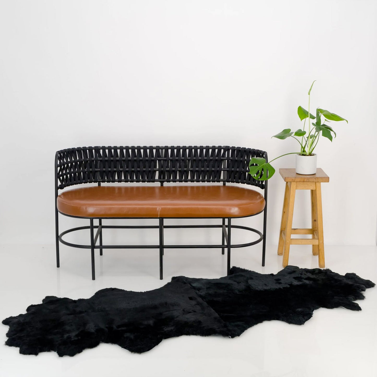 black double sheepskin throw draped over furniture