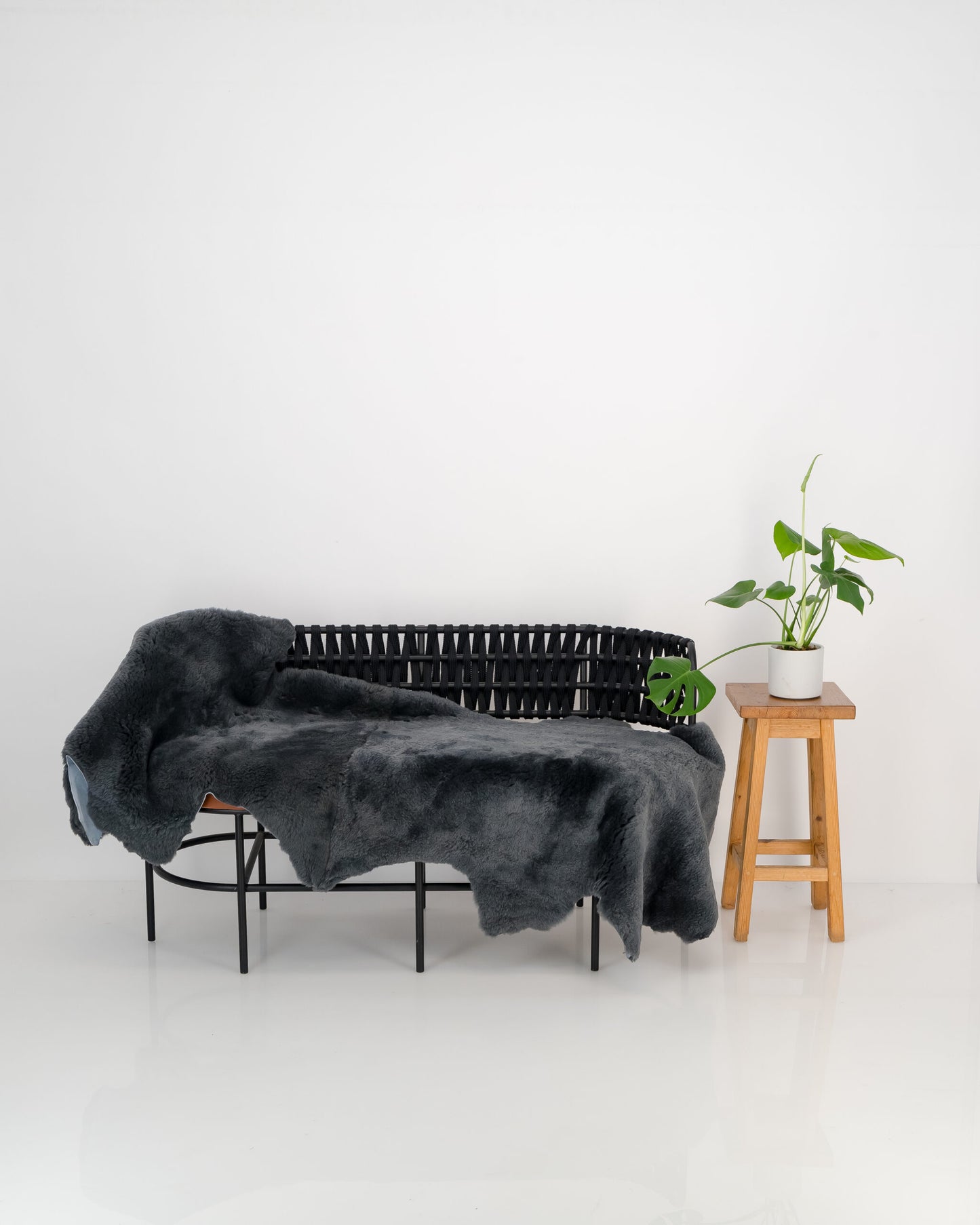grey double sheepskin throw draped over furniture