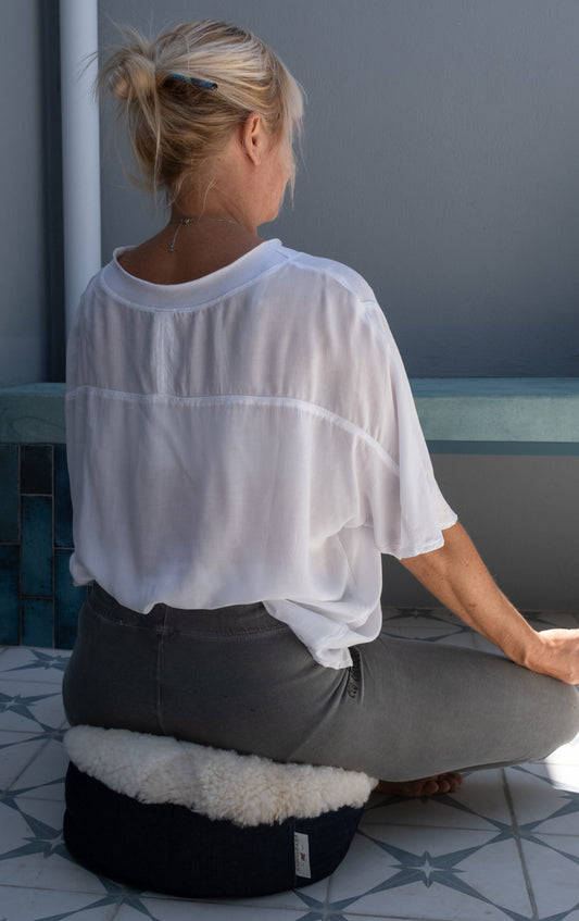 Sheepskin Meditation Cushion , being used