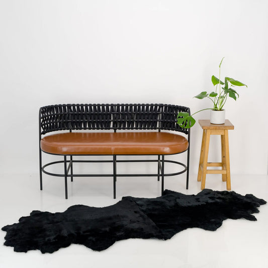 black double sheepskin throw draped over furniture